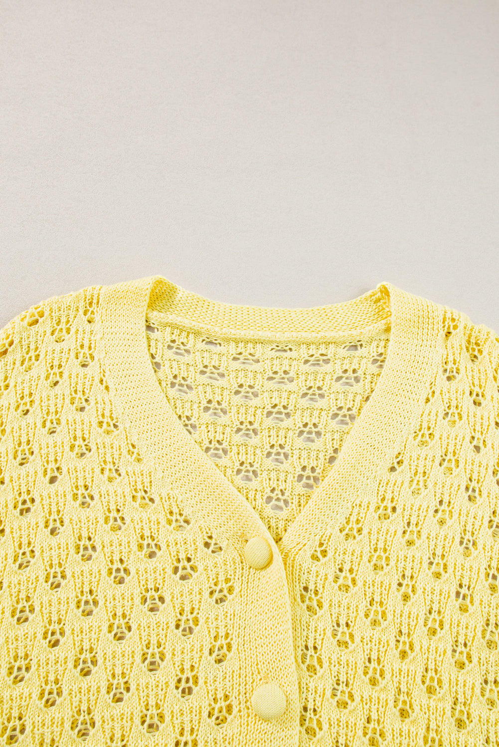 Cardigan pull jaune en maille pointelle à col en V