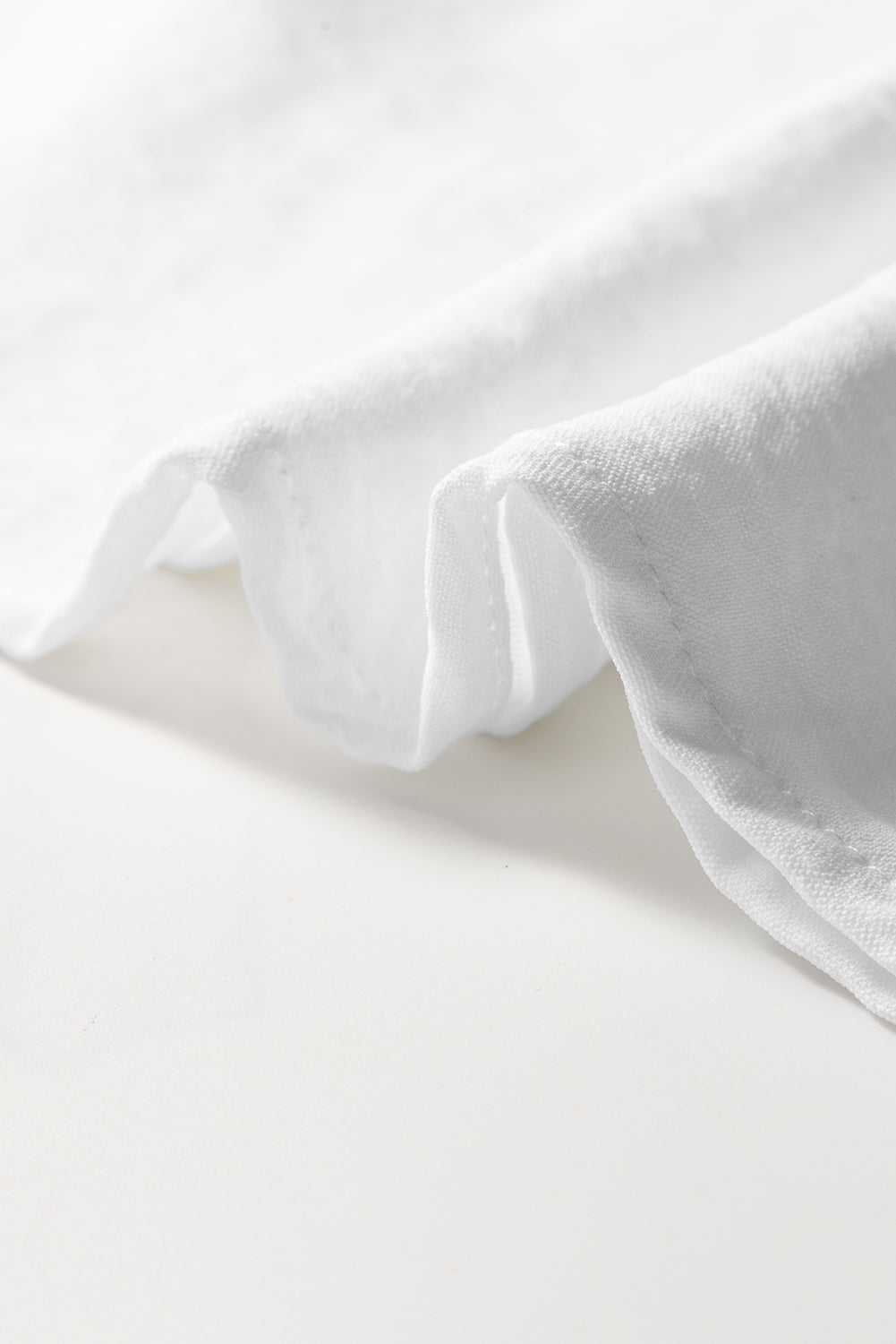 White textured blouse with embroidered ruffles *