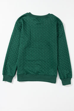 Bright and cheerful cable knit sweatshirt in blackish green