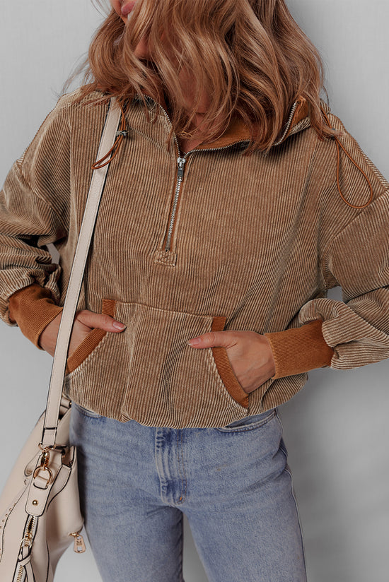 Brown corduroy hoodie with half zip and kangaroo pocket with drawstring