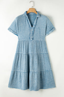 Dress on several levels crumpled with split neckline and raw hem beautiful blue