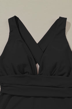 Black monokini with a deep -turned V -neck collar Gathered dar