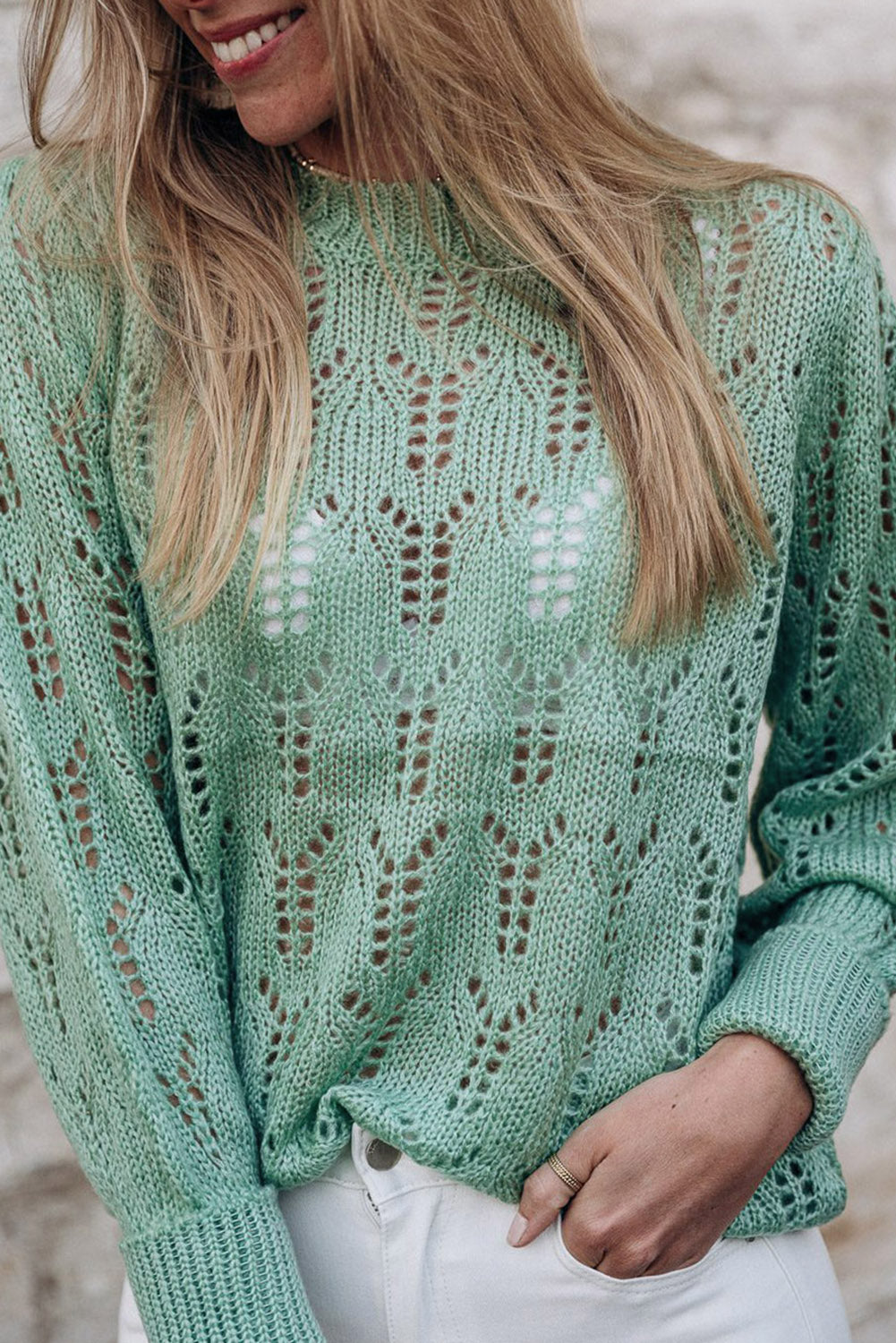 Green sweater in transparent pointelle knit