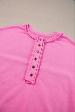 Henley sweatshirt with high and low hem in patchwork of candy sequins