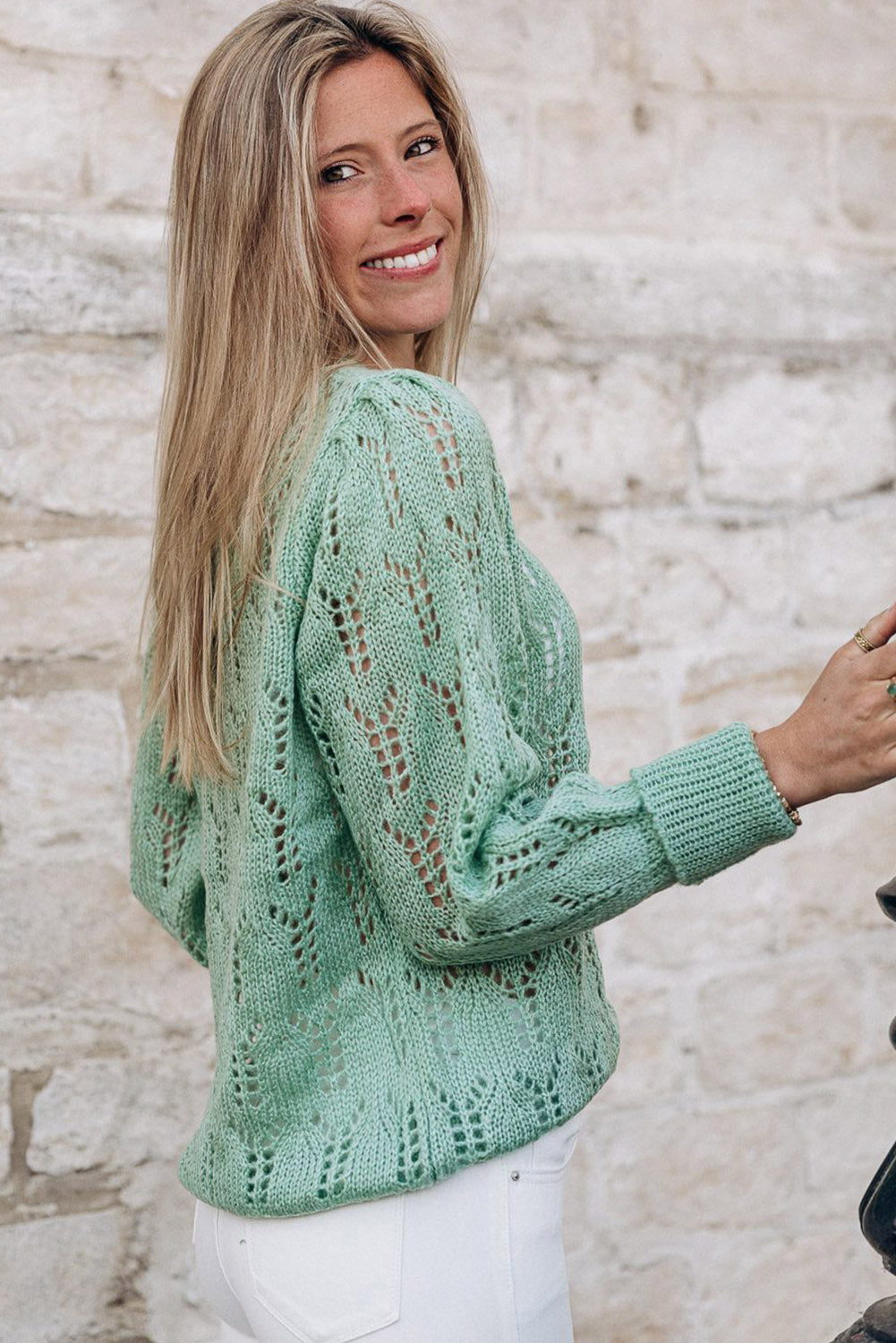 Green sweater in transparent pointelle knit