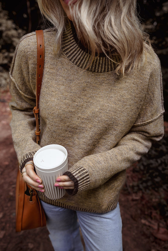 Pale khaki sweater with dropped shoulders and high neck with contrasting trim