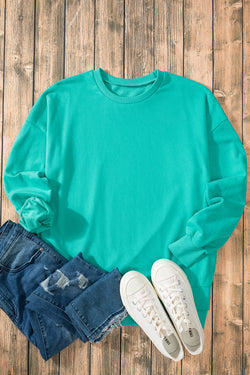 Aruba Blue Solid Crew Neck Sweatshirt with High Low Hem