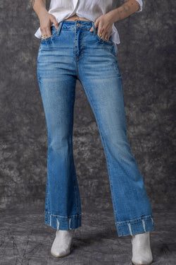 Lightly distressed sky blue flared jeans with a medium wash