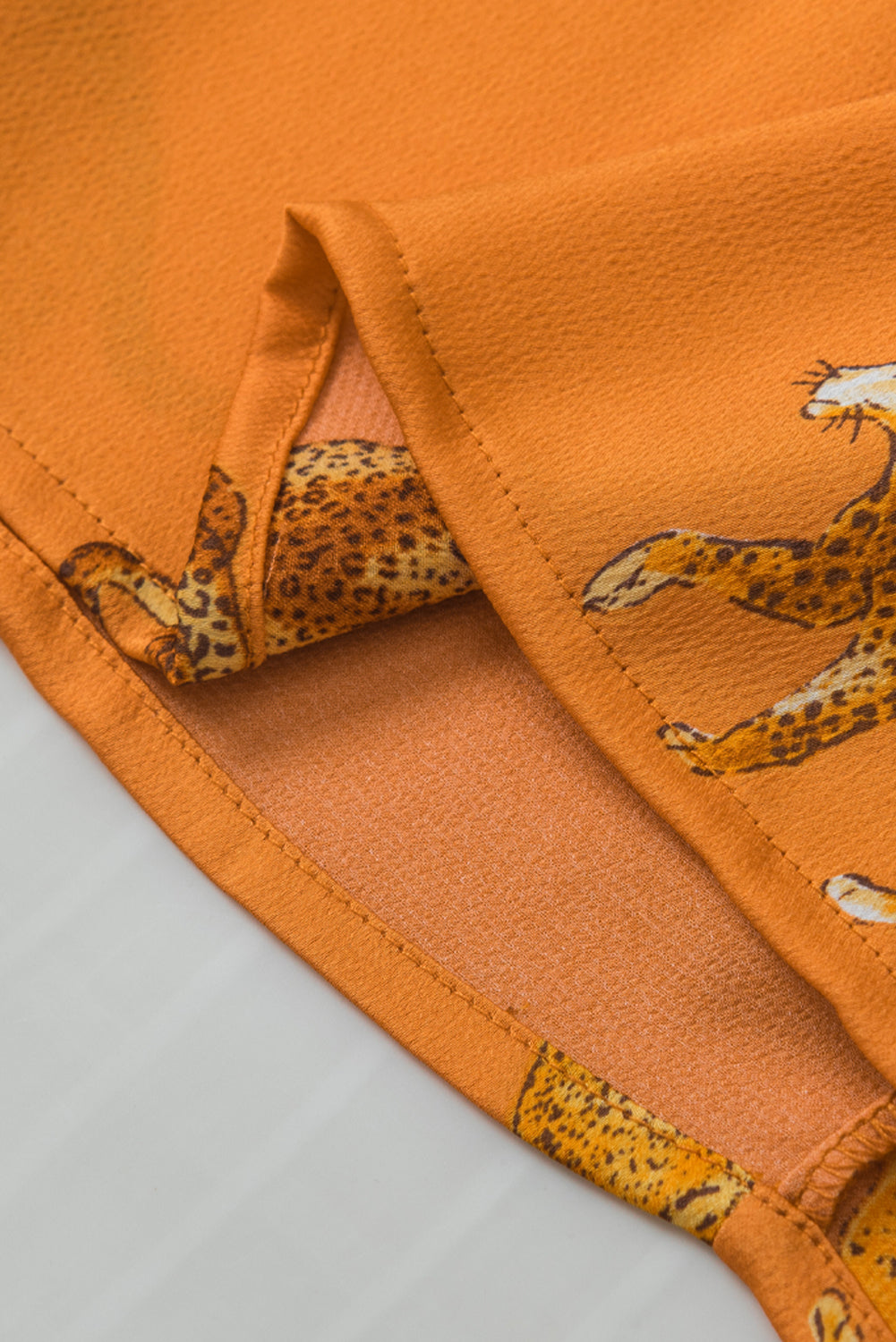 Blouse à manches à volants imprimées orange guépard