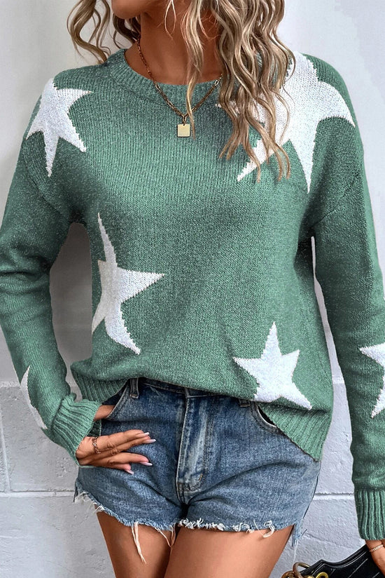 Pull vert à épaules tombantes et motif d'étoiles