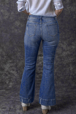 Lightly distressed sky blue flared jeans with a medium wash