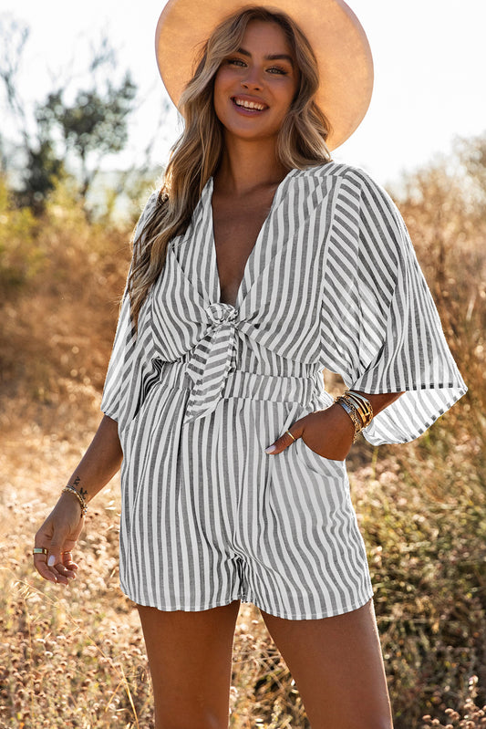 Grey striped romper with 3/4 wide sleeves and knotted front with pockets