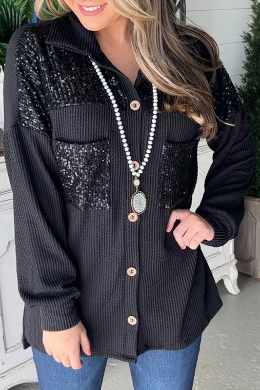 Veste filaire noire avec poche poitrine plaquée et sequins