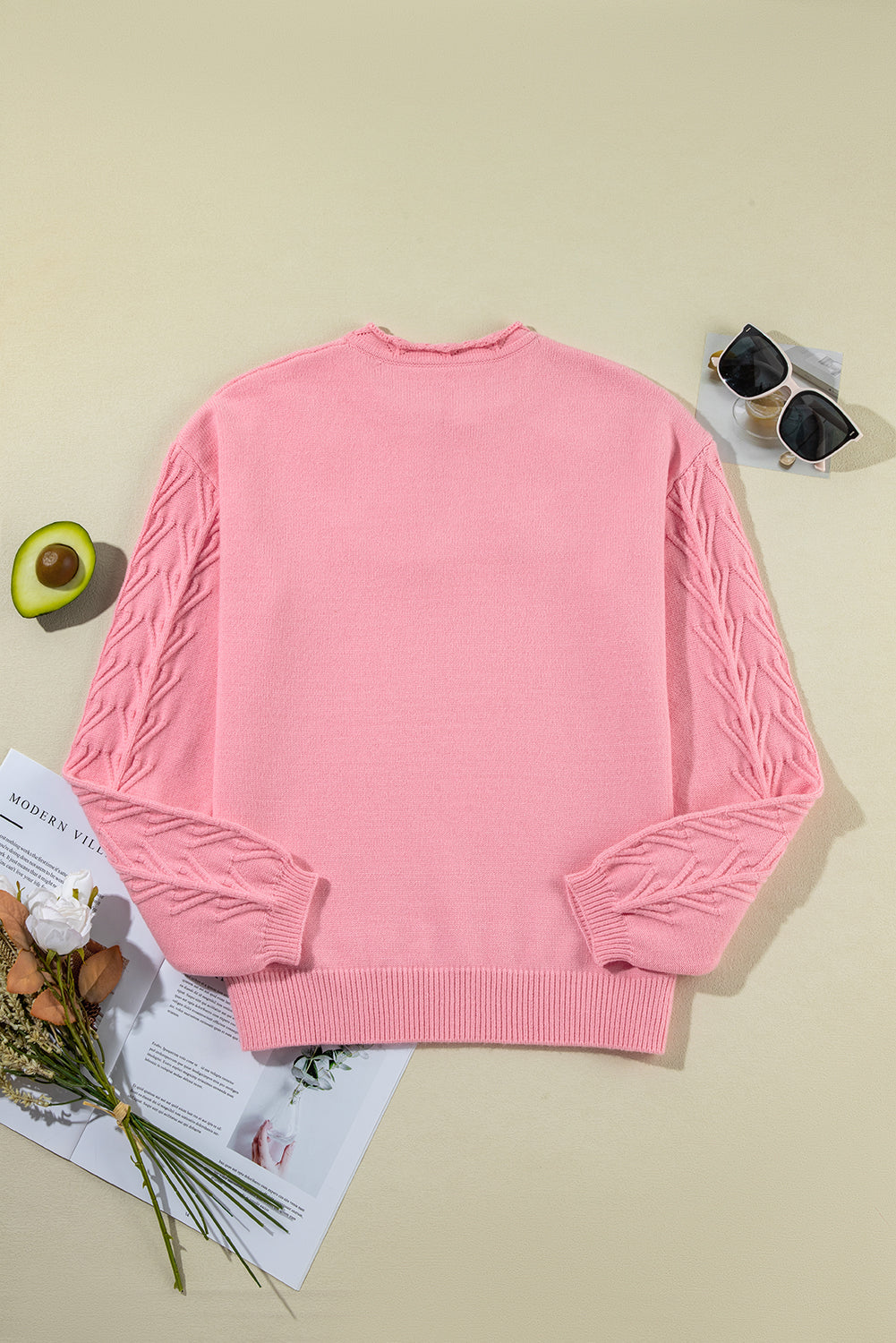 Knitted sweater with notched collar and peach blossom detail