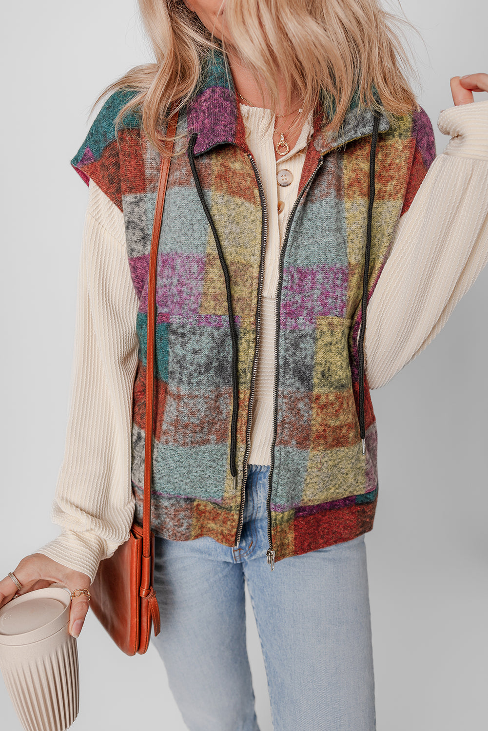 A large zipped vest with multicolored Scottish print with side pockets