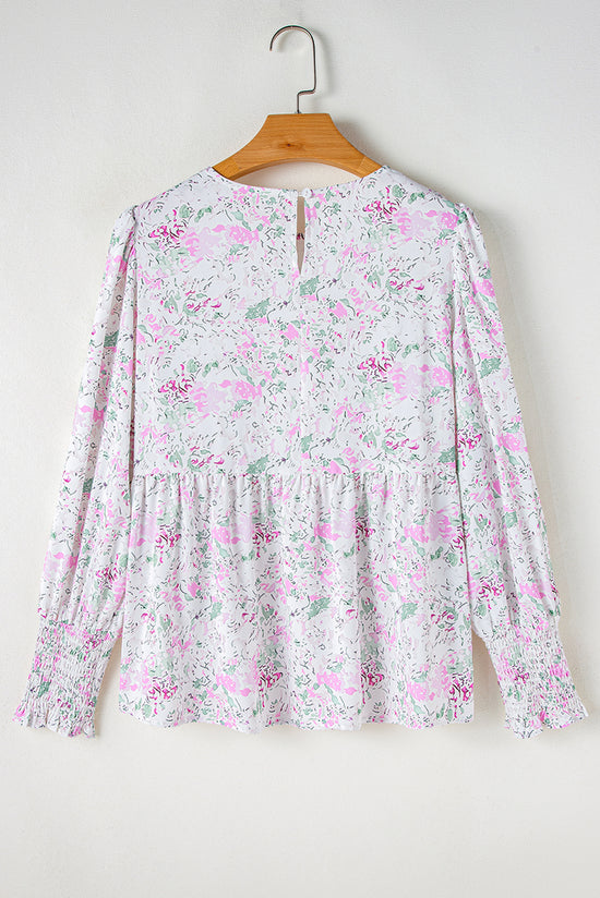 Babydoll pink blouse with floral print and frozen balloon sleeves with lock hole on the back