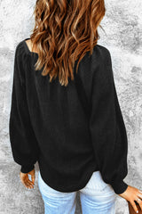 Black waffle knit top with puff sleeves and scoop neck