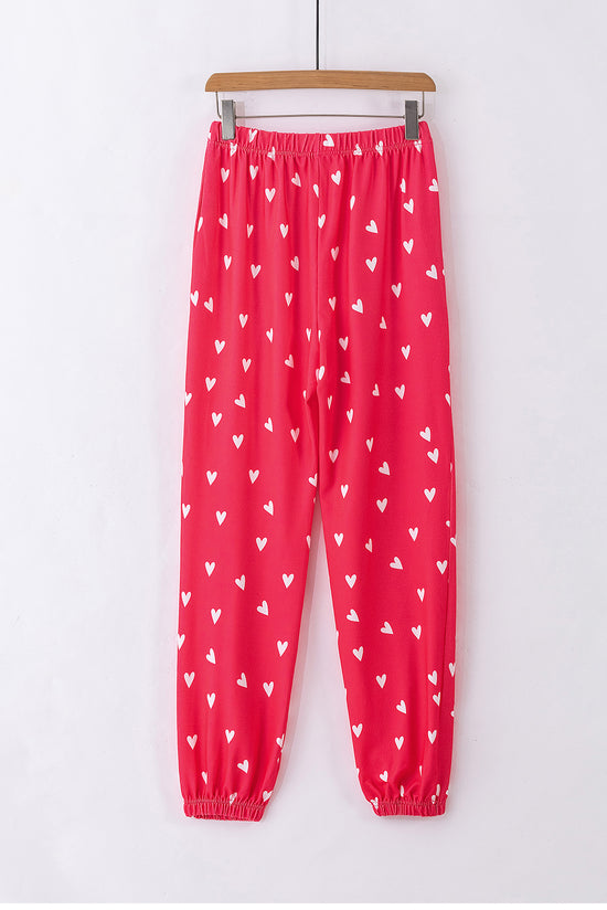 Pantalones rojos brillantes con estampado de corazón para el Día de San Valentín