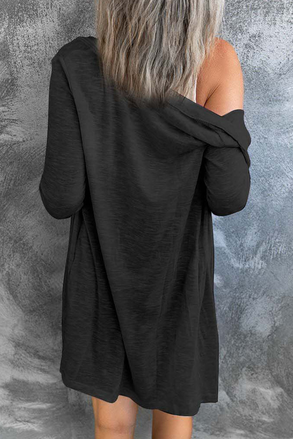 Black open button cardigan in solid color