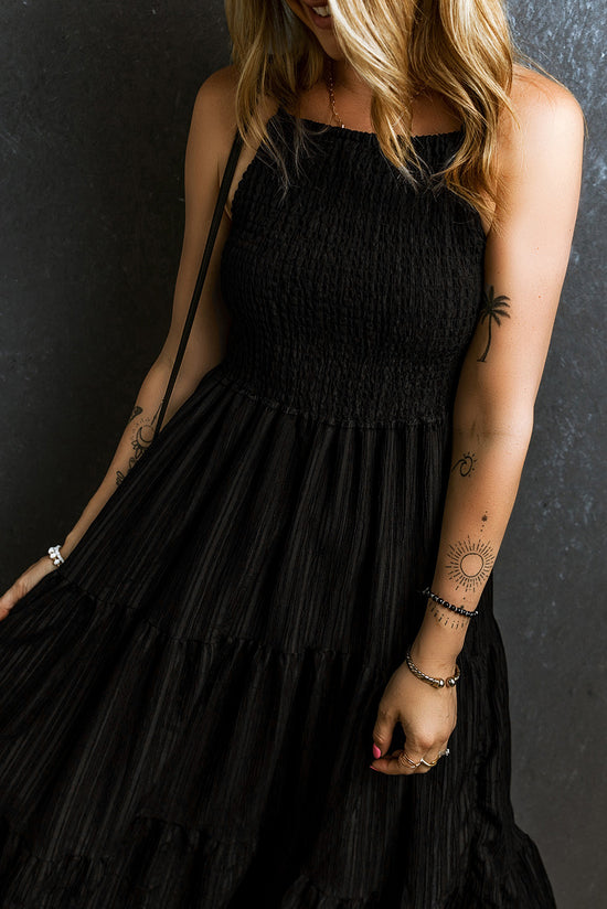 Black long dress with ruffles and spaghetti straps, smocked and pleated