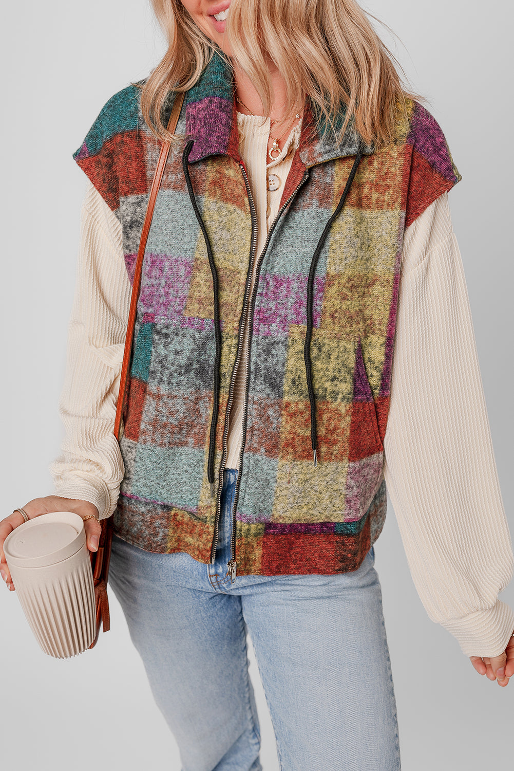 A large zipped vest with multicolored Scottish print with side pockets