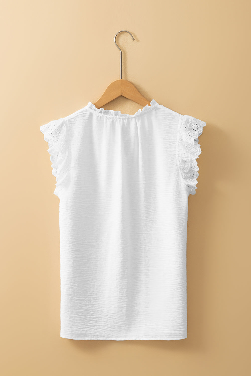 White textured blouse with embroidered ruffles *