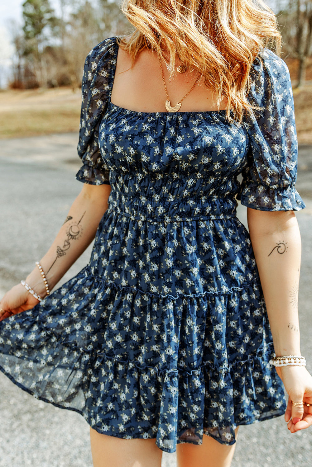 Short dress with ruffles and floral smocking in voile blue