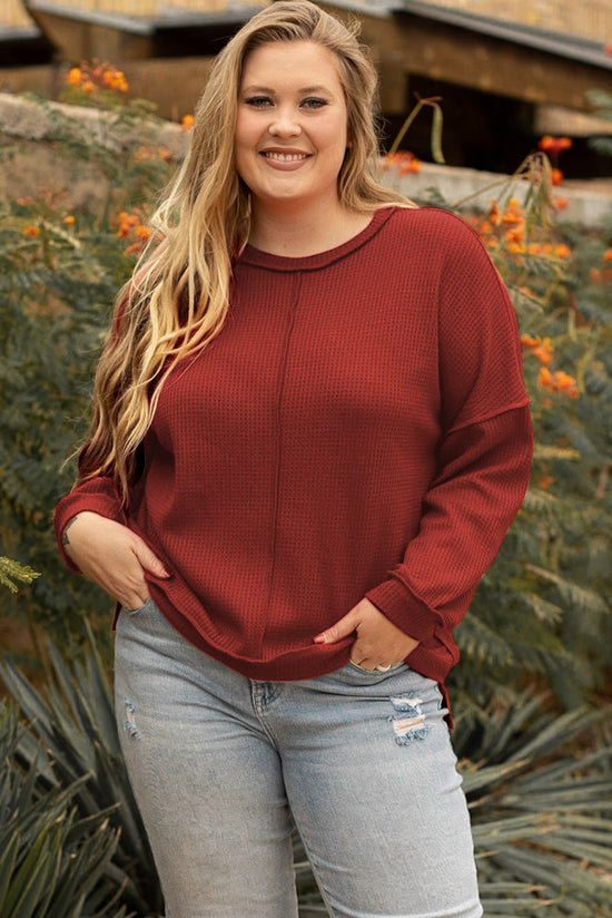 Plus size waffle knit top with exposed seams and gold flame