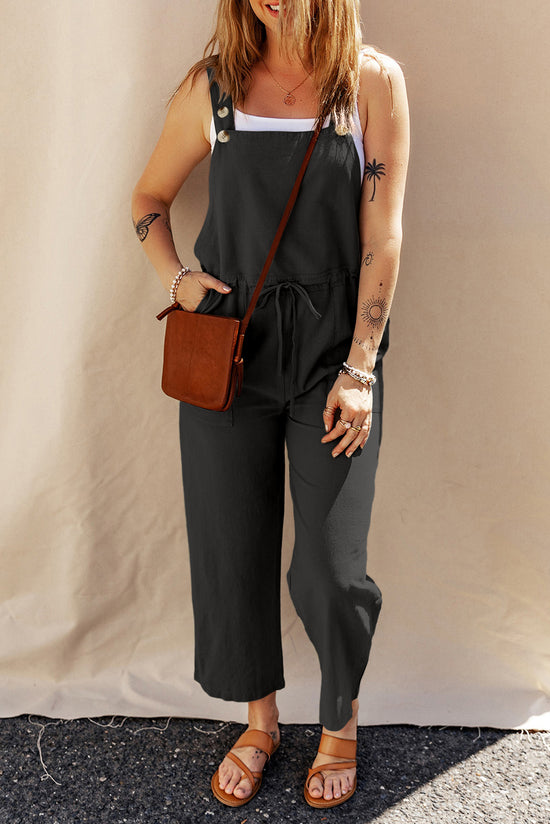 Black short overalls with buttoned straps and drawstring