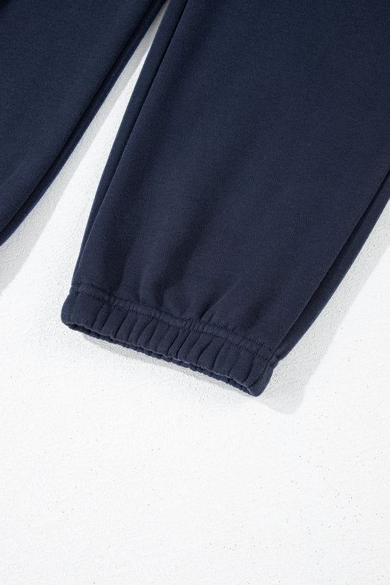 Swears and navy blue jogging sweater and pants in folded collar