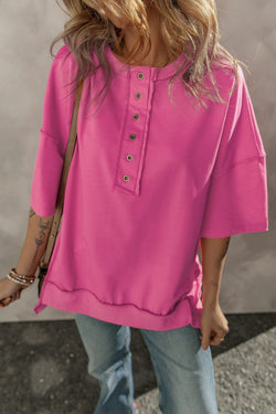 High tunic with wide sleeves and buttoned collar with apparent red pink seams