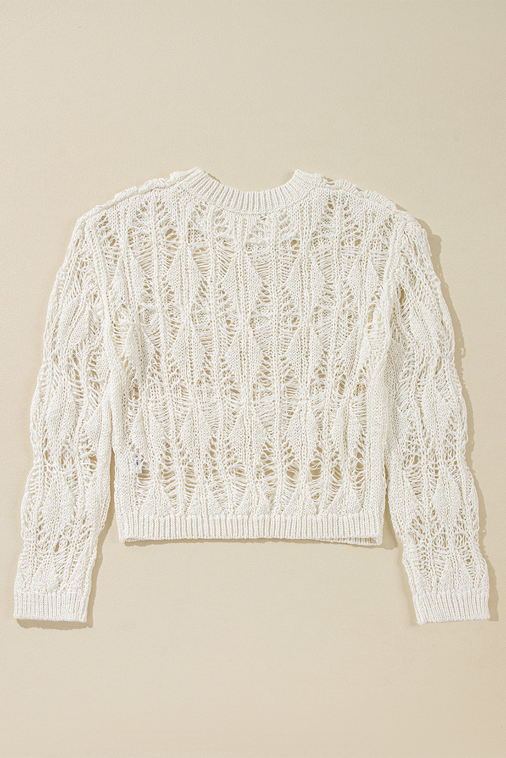 White crew neck loose sweater with crochet cutouts