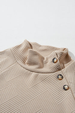 Apricot textured mock neck sweatshirt with asymmetrical buttons