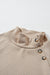 Apricot textured mock neck sweatshirt with asymmetrical buttons