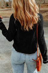 Black textured high with long sleeves and round neck *