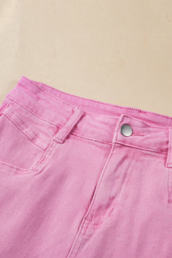 Mid-rise pink denim shorts with frayed edges