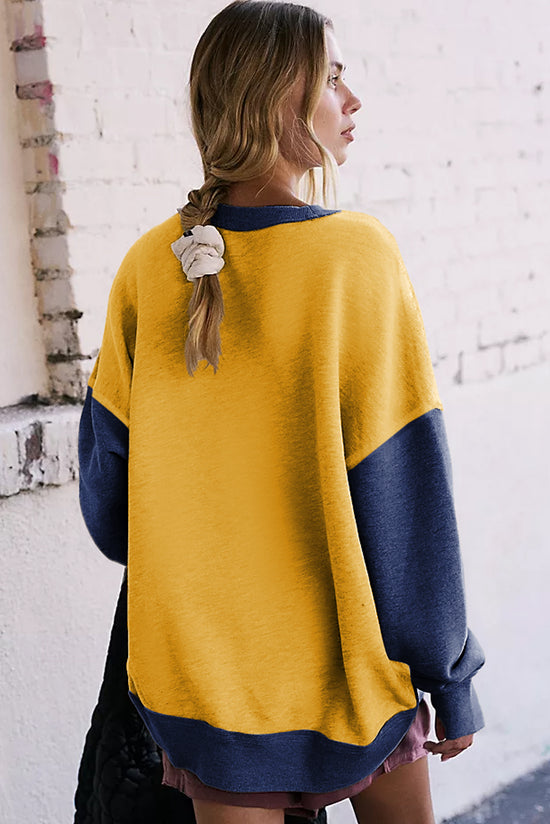 Yellow sweatshirt with dropped shoulders and sleeves with thumb hole