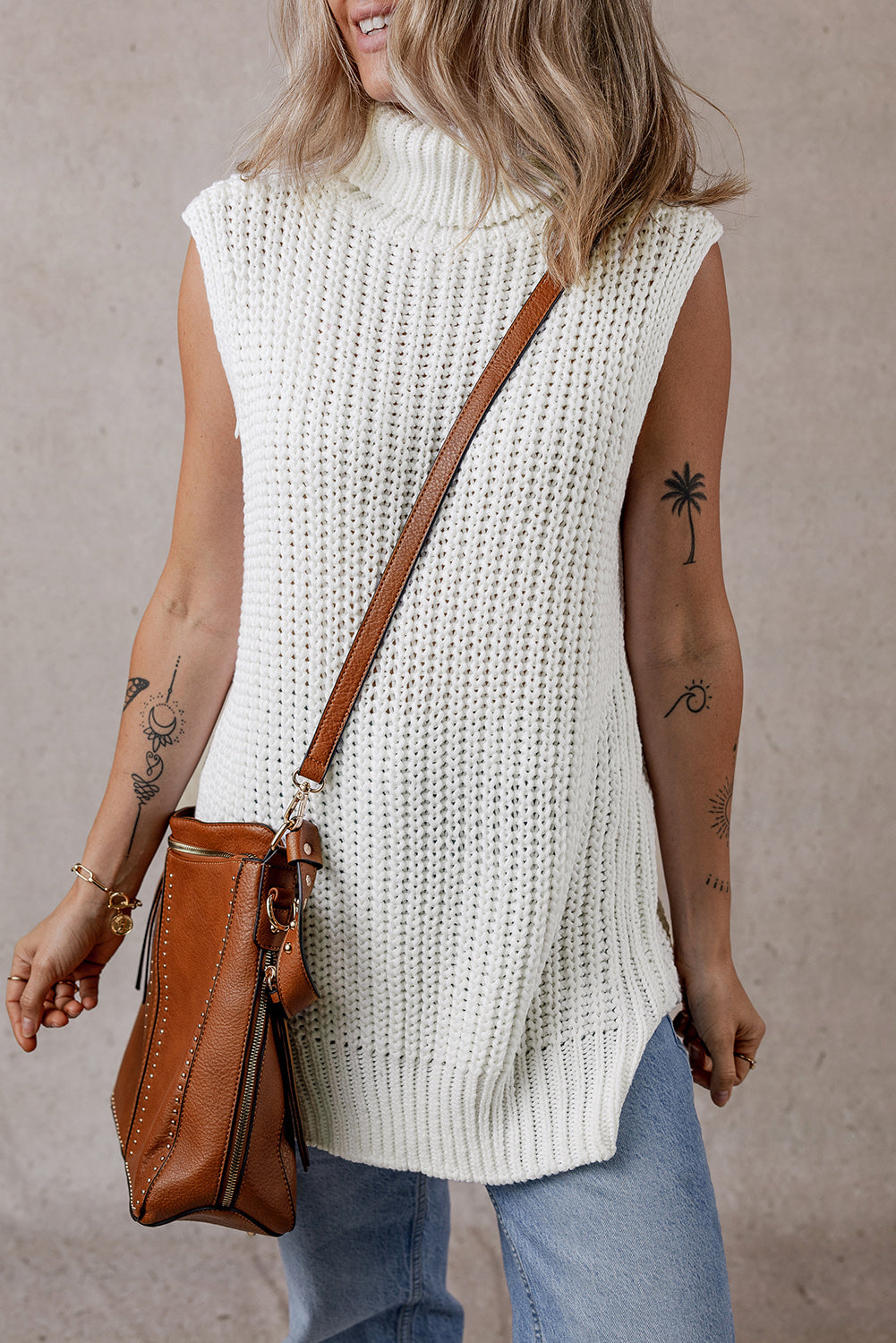 White sweater vest with turtleneck and split hem