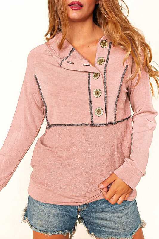 Pink hoodie with buttons on the front and princess seams