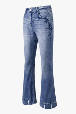 Lightly distressed sky blue flared jeans with a medium wash