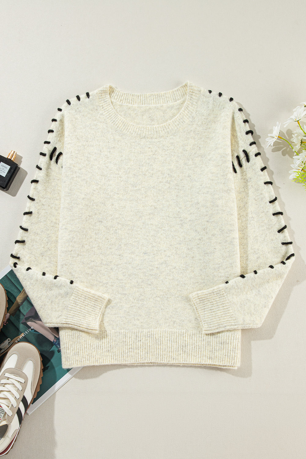 White ribbed sweater with contrast stitching