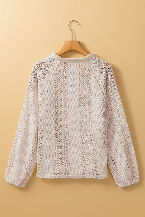 White buttoned shirt in openwork lace with puffy sleeves