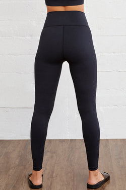 Leggings activos sin costura negra con tamaño arqueado