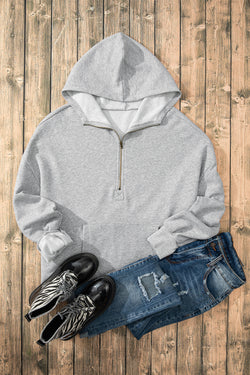 Light grey loose hoodie with half zip and fleece-lined kangaroo pockets