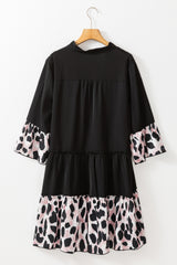 Robe courbée noire à volants et col fendu en patchwork léopard