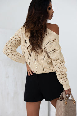 Khaki sweater with twisted knitted knitting with drooping shoulders