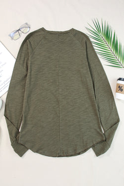 Solid green top with long sleeves and round neck