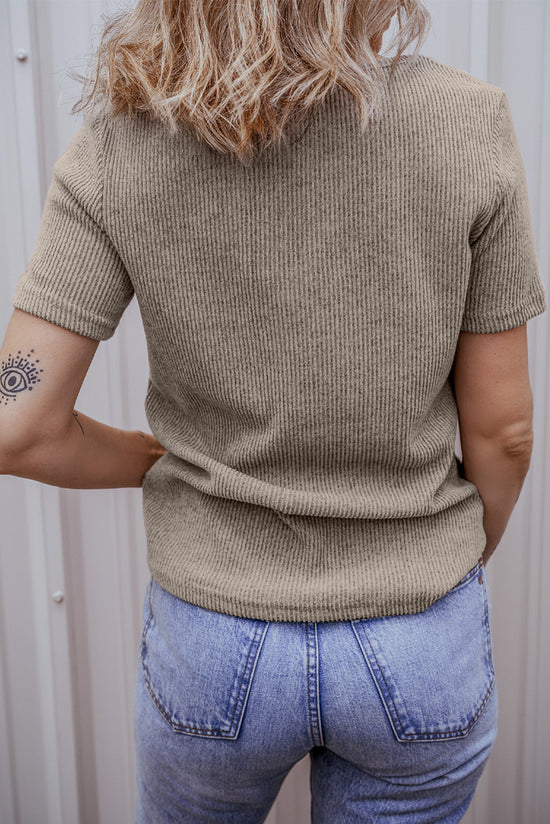 Pale chopped khaki t-shirt with buttoned suspenders and v-collar