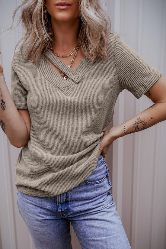 Pale chopped khaki t-shirt with buttoned suspenders and v-collar