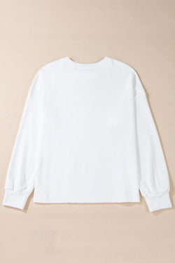 White loose sweatshirt with bow tie pattern and dropped shoulders